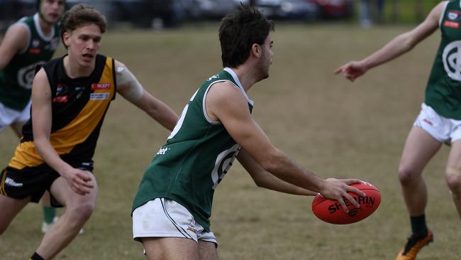 NFNL: Northern Football Netball League Division 1, Melbourne Greyhounds Seniors, Round 15. Heidelberg v Greensborough at Warringa Park, Heidelberg, Victoria, Saturday, 3rd August 2024. Harrison Andronaco on the run.  Photo: Andrew Batsch