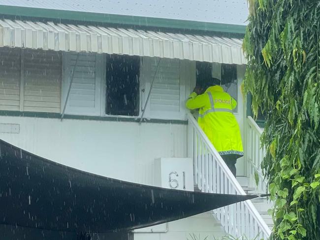 Police at the door of a prperty on 12th Ave, Railway Estate.