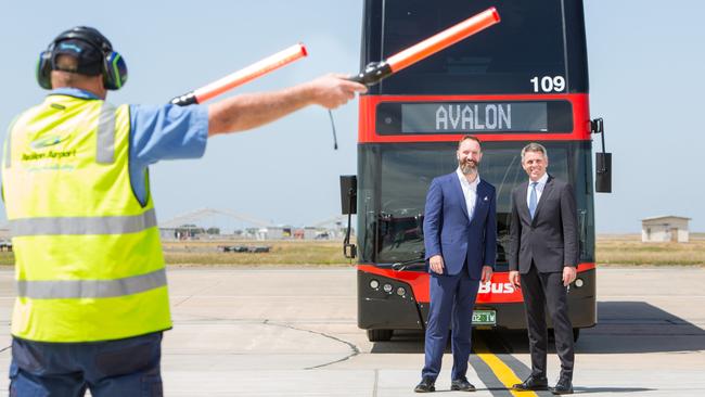 SkyBus co-chief Michael Sewards, right, with colleague Adam Begg has demanded the federal government “explain the business case” for a rail link to Melbourne Airport.