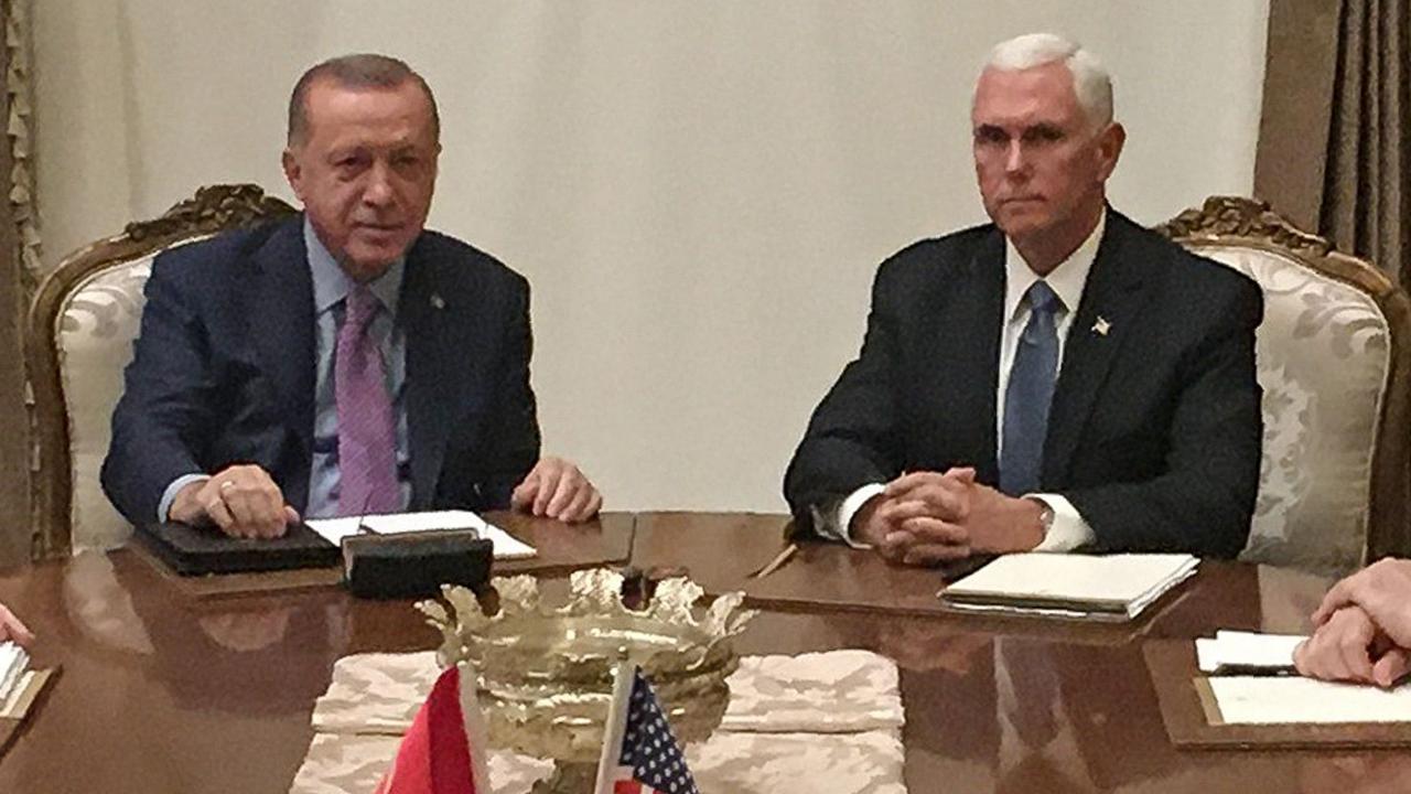 Mr Erdogan and Mr Pence. Picture: Shaun Tandon/AFP