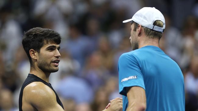 Botic van De Zandschulp of the Netherlands shakes hands with Carlos Alcaraz. (Photo by Matthew Stockman/Getty Images)