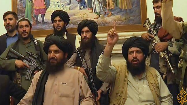 Members of Taliban taking control of the presidential palace in Kabul after Afghanistan's president flew out of the country. Picture: AFP