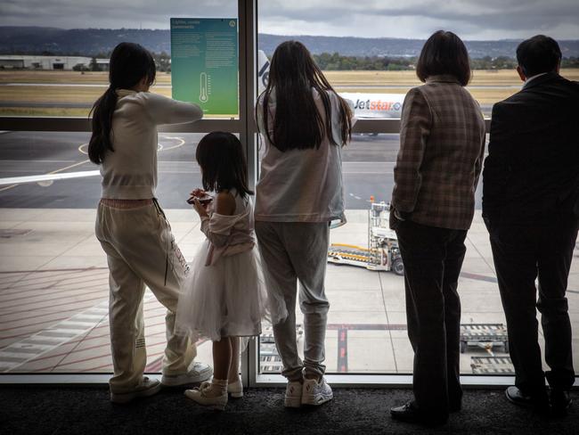 ADELAIDE, SOUTH AUSTRALIA - Advertiser Photos NOVEMBER 28, 2024: FILE image of people inside Adelaide Airport looking out at a Jetstar plane. Picture Emma Brasier