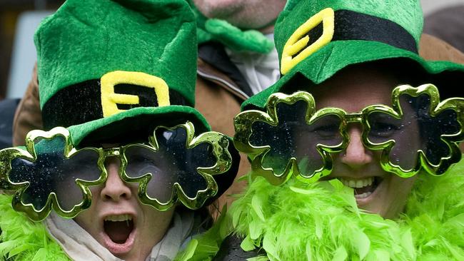 Spectators enjoys the festivities at the St Patrick's Day parade in Montreal, Canada.