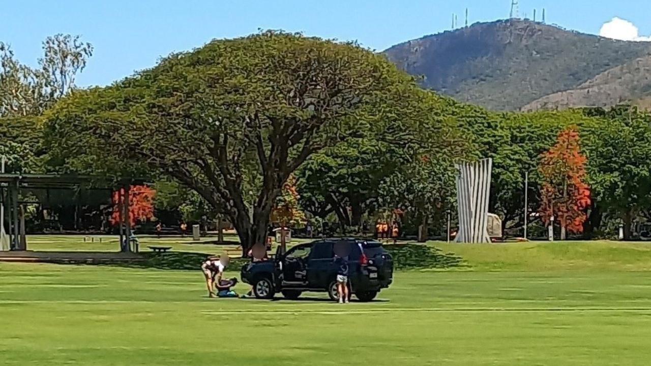 Two men being taken into custody after officers from the Special Emergency Response Team swooped on them at Riverway Park on Monday. Picture: Facebook