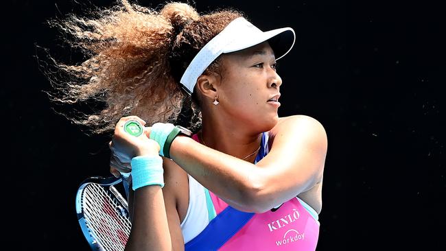 Naomi Osaka of Japan plays a backhand in her first round singles match against Camila Osorio of Colombia.