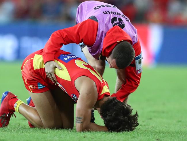 Sean Lemmens of the Suns is injured during the round eight AFL match between the Gold Coast Suns and the Melbourne Demons at Metricon Stadium on May 11, 2019 in Gold Coast, Australia. (Photo by Chris Hyde/Getty Images)