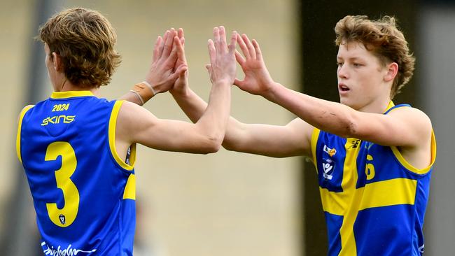 Toby Coleridge of Frankston District is congratulated by Kyle Brice after kicking a goal. (Photo by Josh Chadwick)