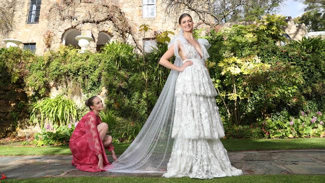 The Manor Basket Range is offering micro weddings for up to 20 people. Elly and Ellie from Finesse Models Australia in couture+love+madness bridal gown and bridesmaid’s dress at The Manor Basket Range. Picture: Tait Schmaal.