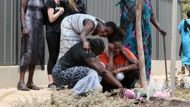 Friends and family mourn the death of Bor Mabil and lay flowers at the site of the car crash. Picture: Emma Brasier