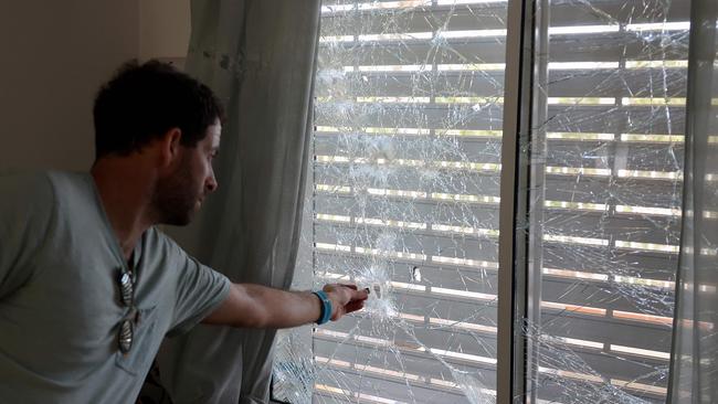 An Israeli inspects the damage at the site of a rocket attack, fired from Lebanon, in Kibbutz of Maagan Michael, south of Haifa earlier this week, amid the ongoing war between Israel and Hezbollah. Picture: Jack Guez / AFP