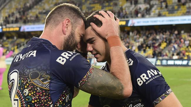 Kyle Feldt congratulates Jake Clifford after his final game for the Cowboys.