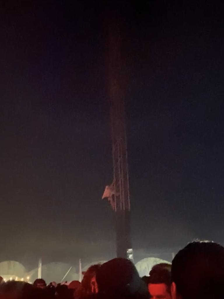 A festival goer is seen climbing the rails of Wildlands festival. Picture: Supplied