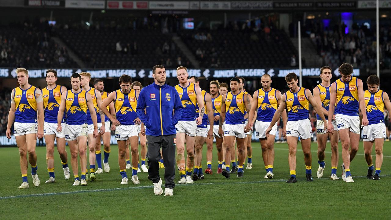 The Eagles walk off Marvel Stadium after another big loss on Saturday. Picture: Morgan Hancock/AFL Photos