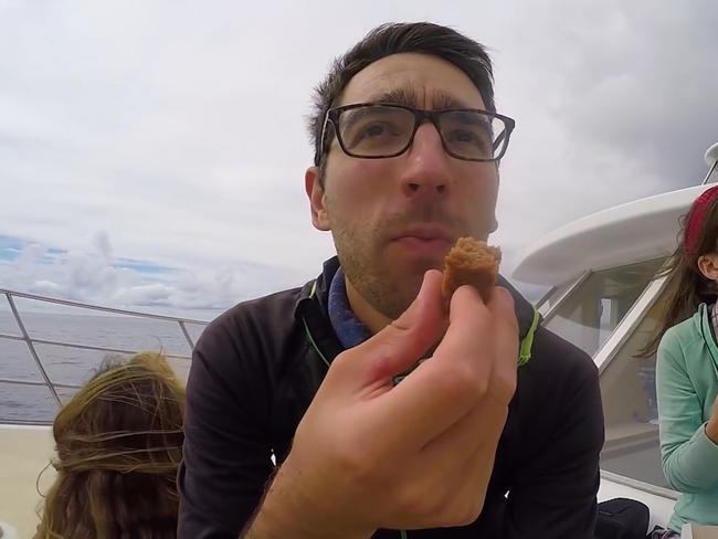 A former tourist of White Island eating lunch on the boat tour in 2018. Picture: Still from White Island Active Volcano Tour in Whakatane – New Zealand's Biggest Gap Year – Backpacker Guide, 2018, from NZ Pocket Guide YouTube Channel