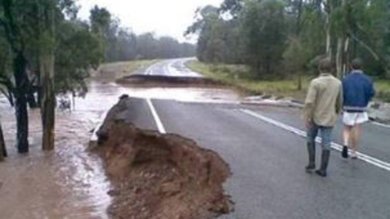 VIDEO: Road washed away in floods | The Courier Mail