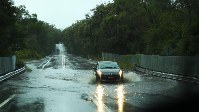 Flooding on the Wakehurst Parkway which has forced police to close the road. Picture John Graing