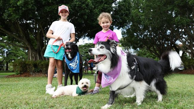 Zoe Ramsay and Lyla Thomas with their dogs Koda, Jax and Saphy after completing the RSPCA's Million Paws Walk fundraiser, held along the Cairns Esplanade. Picture: Brendan Radke