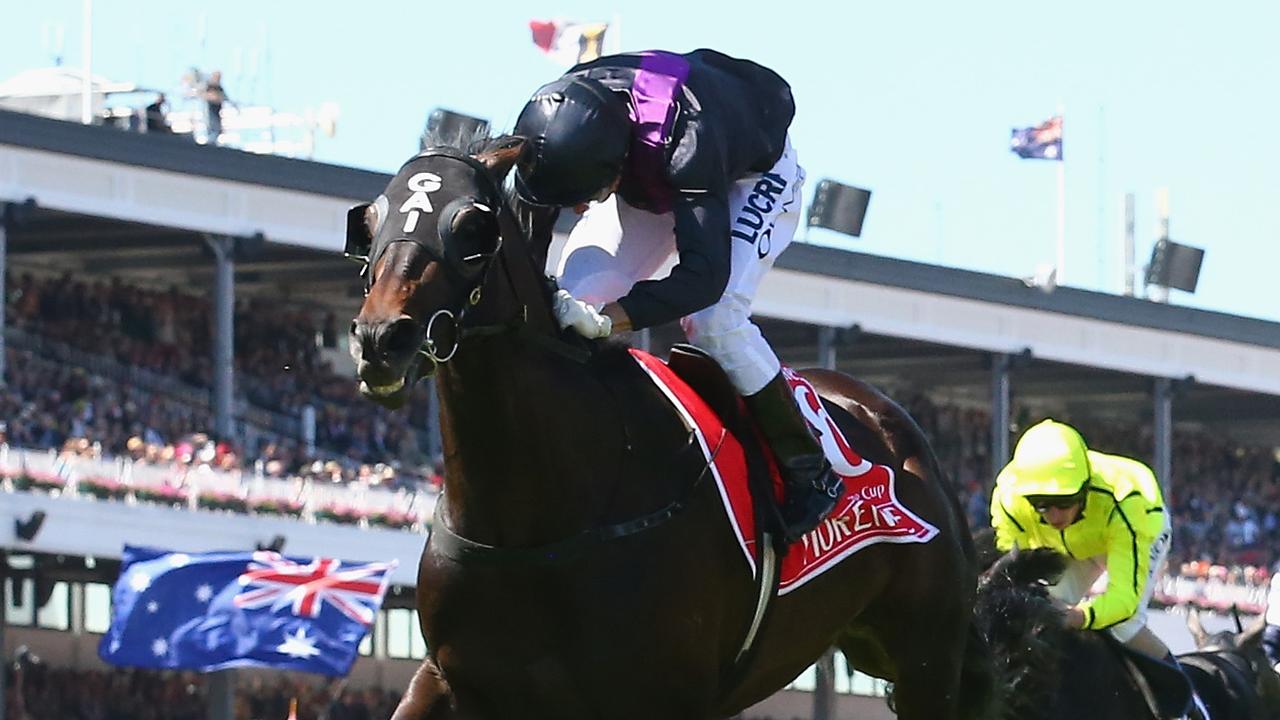 MELBOURNE, AUSTRALIA - NOVEMBER 05:  Damien Oliver riding #6 Fiorente wins the Emirates Melbourne Cup during Melbourne Cup Day at Flemington Racecourse on November 5, 2013 in Melbourne, Australia.  (Photo by Robert Cianflone/Getty Images)