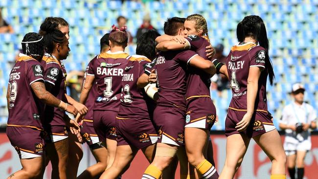 Heather Ballinger celebrates with Broncos teammates after scoring a try during the NRL Women's Premiership Grand Final at ANZ Stadium. Picture: AAP