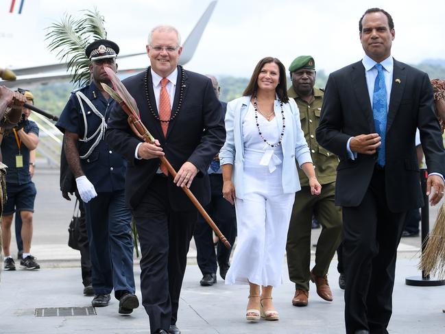 Australian Prime Minister Scott Morrison and Mrs Morrison are greeted by Vanuatu Minister of Foreign Affairs Ralph Regenvanu (right) as they arrive in Port Vila, Vanuatu, Wednesday, January 16, 2019. The prime minister will discuss Australian infrastructure investment, the Pacific labour hire scheme, and building cultural, economic and social ties between the two countries. (AAP Image/Dan Himbrechts) NO ARCHIVING