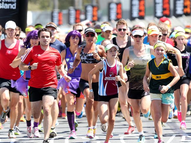 Hayley Bateup and the start of the fun run during Day 2, Saturday of the GC 660 through the streets of Surfers Paradise. Pics Adam Head