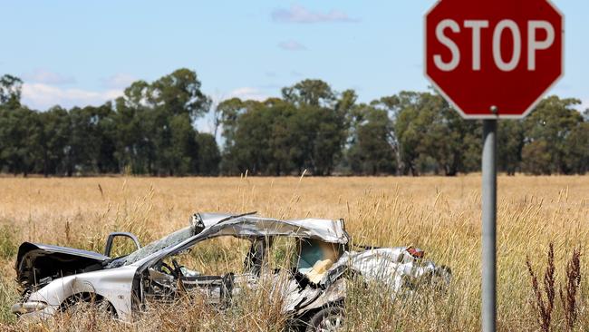 The car in which four people died is pictured in a paddock near Shepparton.The collision occurred  on the corner of Pine Lodge North Rd and Cosgrove-Lemnos Rd. Pine Lodge. The silver sedan went  through a stop sign on Pine Lodge North Rd and collided with a ute and trailer. Picture: Ian Currie