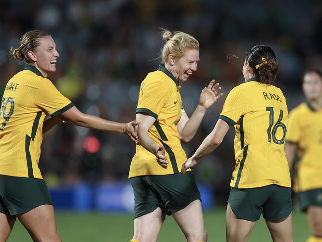 Polkinghorne (C) celebrates a goal in her record 152nd appearance for the Matildas. Picture: Cameron Spencer/Getty Images