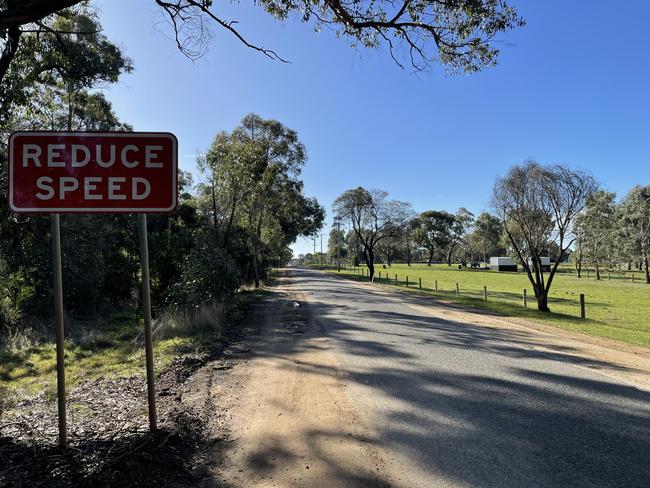 A reduce speed sign on Finchs Road before it intersects with Greenhalghs Road.