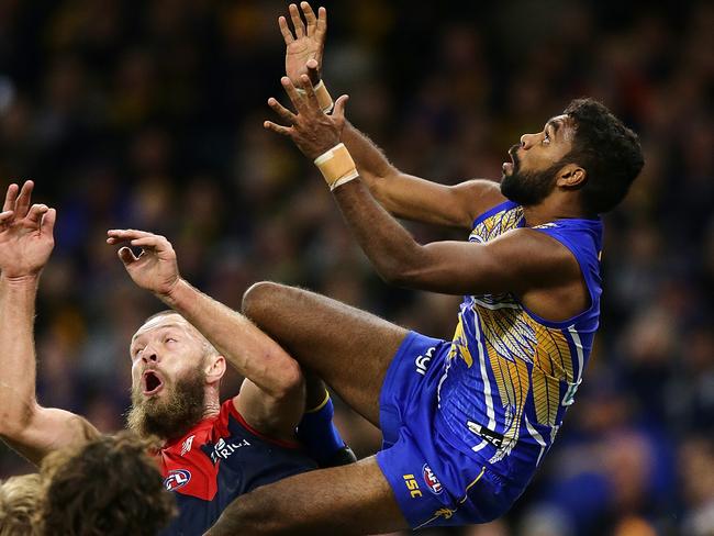 Liam Ryan launches over Melbourne ruckman Max Gawn. Picture: AFL Photos