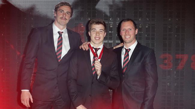 Joint Crichton Medal runners up Joe Daniher and James Kelly flank winner Zach Merrett. Picture: Sarah Matray