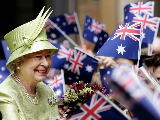 The Queen receives flowers from waiting schoolchildren after the Commonwealth Day Service in Sydney, 2006. Picture: Rob Griffith