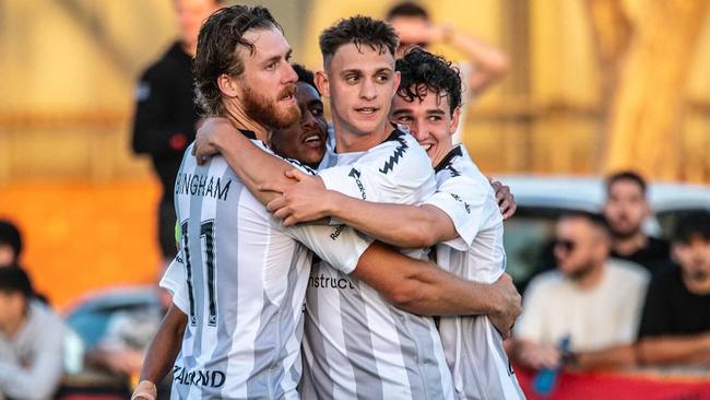 Hume City celebrates a goal against Dandenong Thunder.