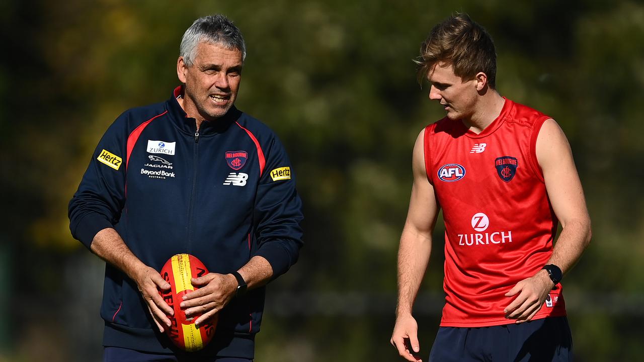 MELBOURNE, AUSTRALIA – MAY 24: James Jordan of the Demons works with assistant coach Mark Williams during a Melbourne Demons AFL training session at Gosch's Paddock on May 24, 2021 in Melbourne, Australia. (Photo by Quinn Rooney/Getty Images)