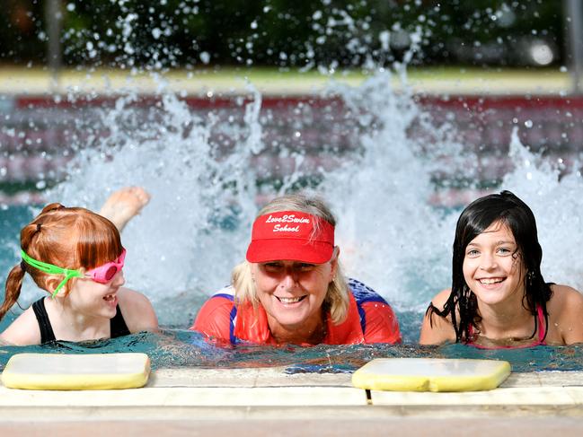 Love2Swim School senior swim teacher Sharon Mulligan with students Mackenzie Fog 7 and Lila Eglit 8. Picture: Alix Sweeney