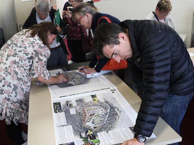 Residents check out the detailed plans for the Rosny Hill proposal.