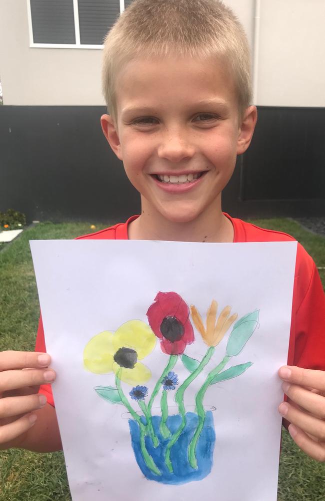 Ollie Longland with a bunch of flowers for his grandmother. Picture: Supplied.