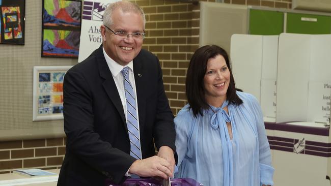 Scott Morrison is assisted by his wife, Jenny, as he casts his ballot in a federal election in Sydney. Picture: Rick Rycroft/AP