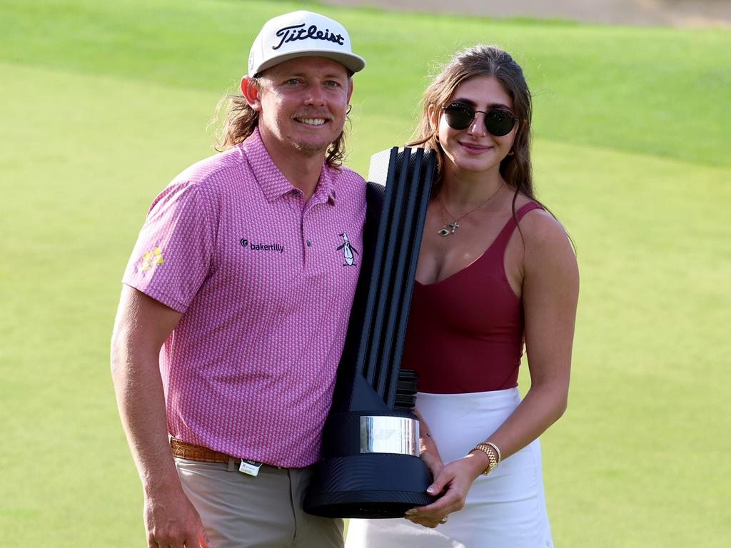 Cameron Smith of Australia poses with his girlfriend Shanel Naoum after his win on day three of LIV Golf London at The Centurion Club. Picture: Tom Dulat/Getty Images