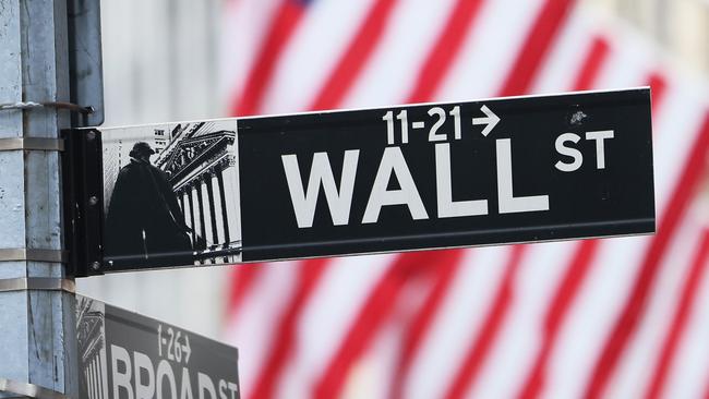 NEW YORK, NEW YORK - JUNE 08: A Wall Street sign is seen outside of the New York Stock Exchange during morning trading on June 08, 2022 in New York City. The Dow Jones, S&P and Nasdaq opened down for the first time in three days.   Michael M. Santiago/Getty Images/AFP == FOR NEWSPAPERS, INTERNET, TELCOS & TELEVISION USE ONLY ==