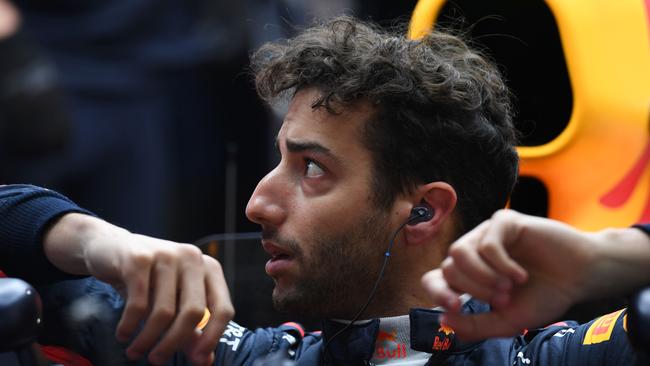 Red Bull's Australian driver Daniel Ricciardo waits in the pits during practice ahead of the Formula One Chinese Grand Prix in Shanghai on April 7, 2017. / AFP PHOTO / GREG BAKER