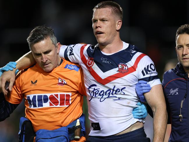 SYDNEY, AUSTRALIA - JULY 28:  Lindsay Collins of the Roosters is attended to by trainers after a head clash during the round 20 NRL match between the Manly Sea Eagles and the Sydney Roosters at 4 Pines Park on July 28, 2022, in Sydney, Australia. (Photo by Cameron Spencer/Getty Images)