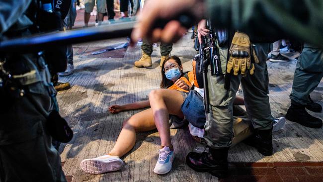 Protesters being detained in Hong Kong on Friday. Picture: Anthony Wallace/AFP