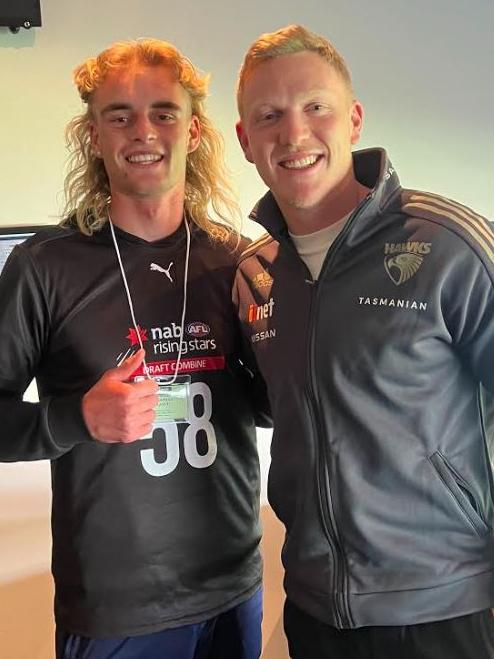 Glenelg footballer Jakob Ryan (left) with his hero Hawthorn’s James Sicily.