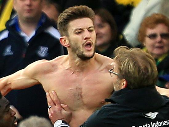 NORWICH, ENGLAND - JANUARY 23: Adam Lallana (2nd R) of Liverpool ceelbrates scoring his team's fifth goal with his manager Jurgen Klopp (1st R) and team mate Kolo Toure (3rd R), Lucas Leiva (2nd L) and Roberto Firmino (1st L) during the Barclays Premier League match between Norwich City and Liverpool at Carrow Road on January 23, 2016 in Norwich, England. (Photo by Stephen Pond/Getty Images)