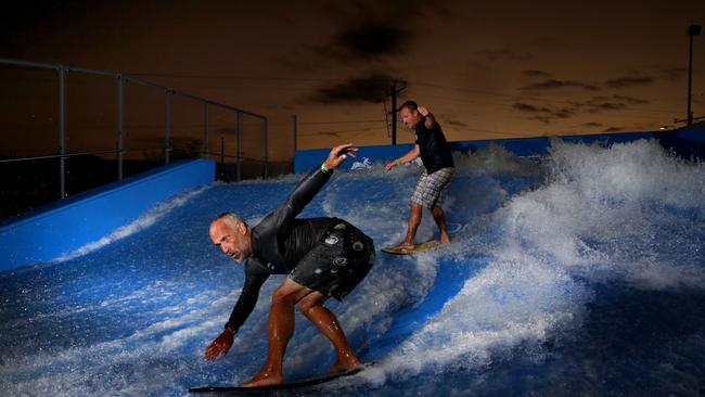 Sean Alberts and Phil Scott catching the only wave in Cairns at the Flowrider at the Tobruk pool PICTURE: ANNA ROGERS