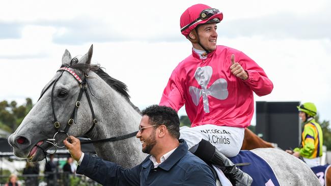 Jordan Childs returns to the mounting yard on Fabergino after winning the Kensington Stakes.