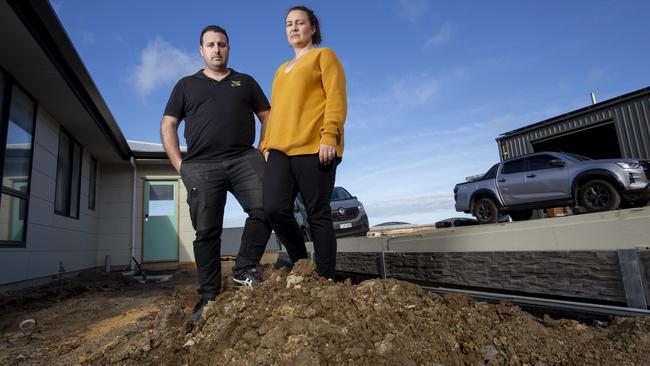 Jason and Amy Varacalli have told of their heartache and rising costs because of the asbestos problem. Picture: Brett Hartwig