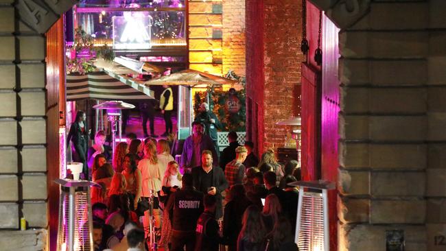 A large crowd of people queue up outside the Argyle in the Rocks, Sydney. Picture by Damian Shaw