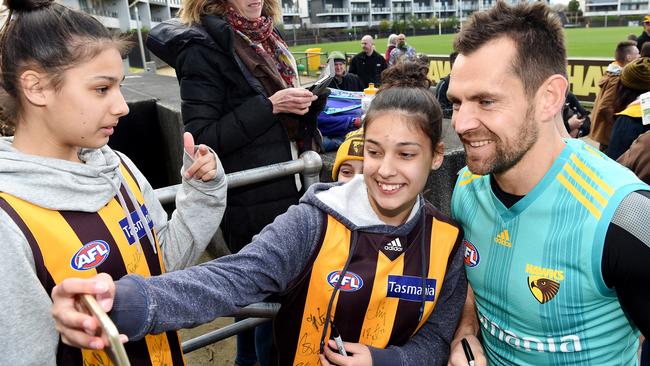 Luke Hodge signs autographs and has photos taken with fans after Hawthorn training at Waverley Park ahead of his final AFL game. Picture: Nicole Garmston